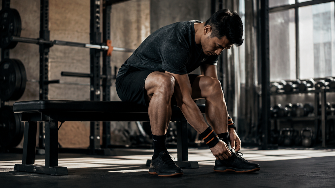 Athlete preparing for a focused strength-training session in a modern gym