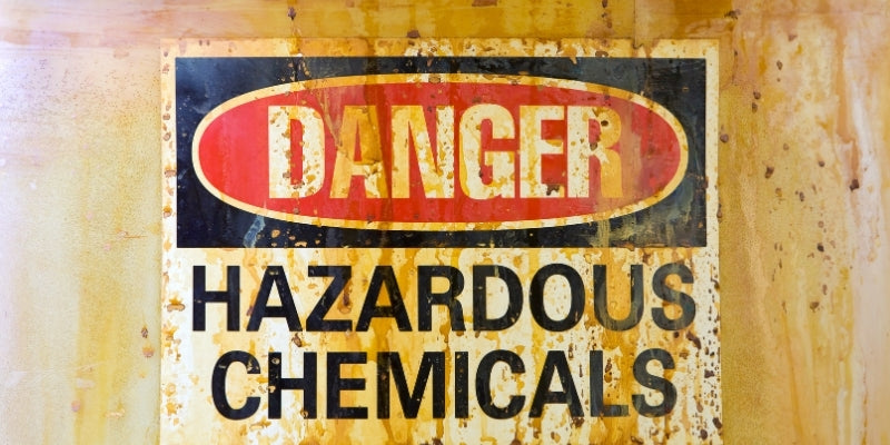 a dirty sign reading 'danger - hazardous chemicals'